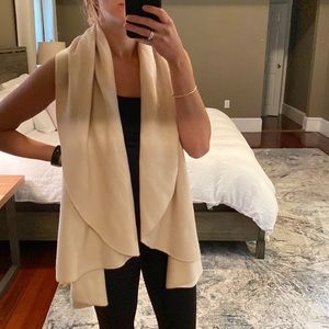New without tags. Beige sweater vest shawl.